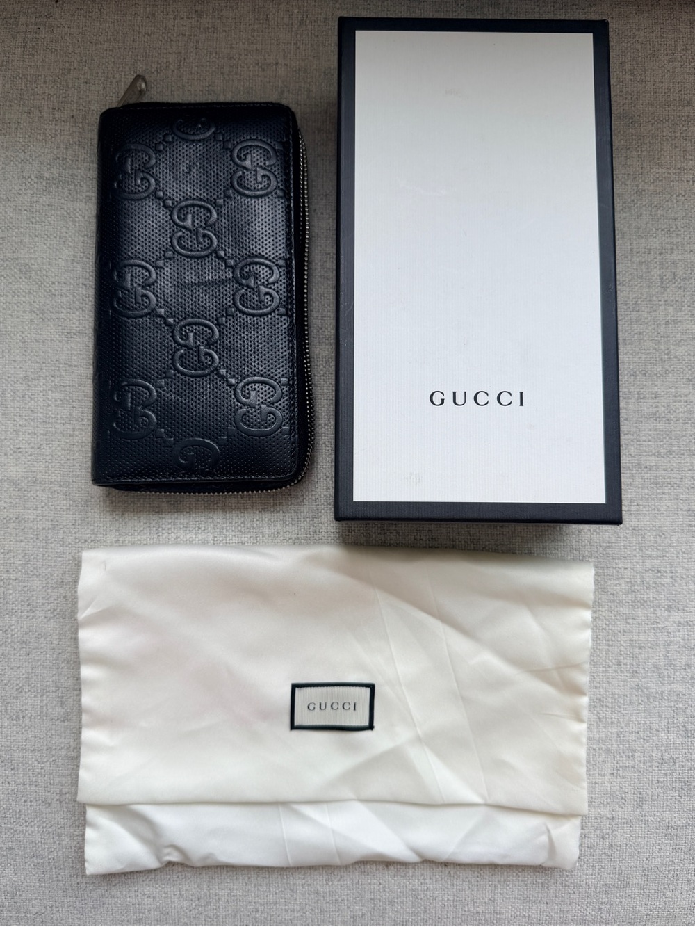 Gucci Black Embossed GG Zip Wallet